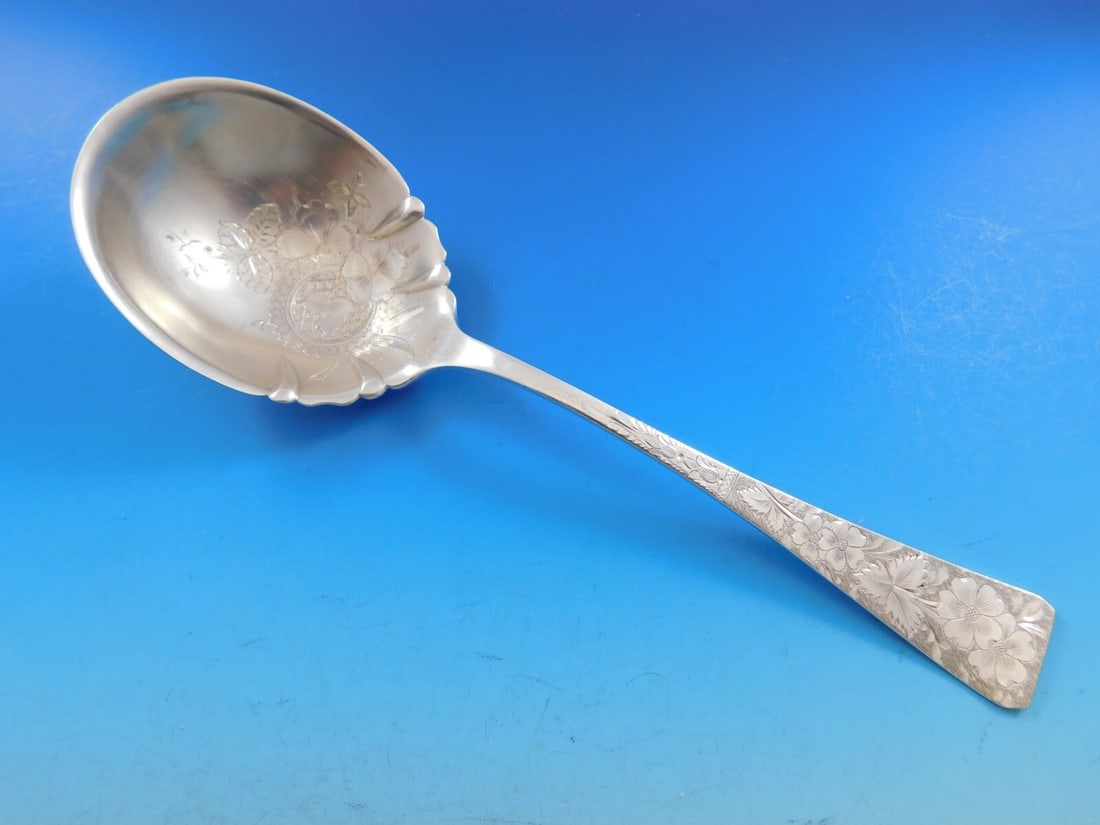 Bailey Banks Biddle Sterling Silver 9 Inch Brite Cut Berry Spoon: Bailey Banks Biddle Sterling Silver 9 Inch Brite Cut Berry Spoon This exquisite 9-inch berry spoon, crafted by Bailey Banks & Biddle, showcases a stunning Brite Cut design adorned with intricate flowe