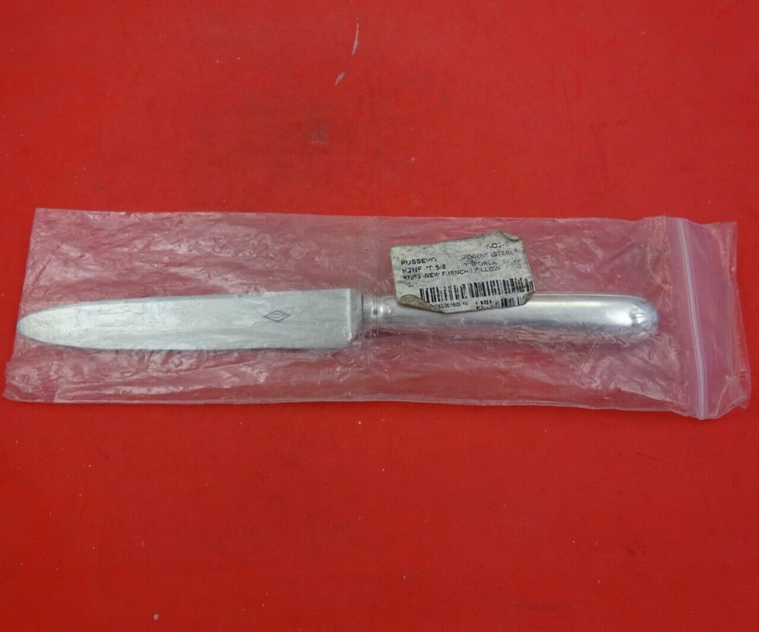 Puiforcat Sevigne Old Sterling Silver Dinner Knife 9 3/4 Pointed: Puiforcat Sevigne Old Sterling Silver Dinner Knife 9 3/4 Pointed This elegant dinner knife is part of the Sevigne Old pattern by Puiforcat. Crafted with a sterling silver hollow handle and a pointed s