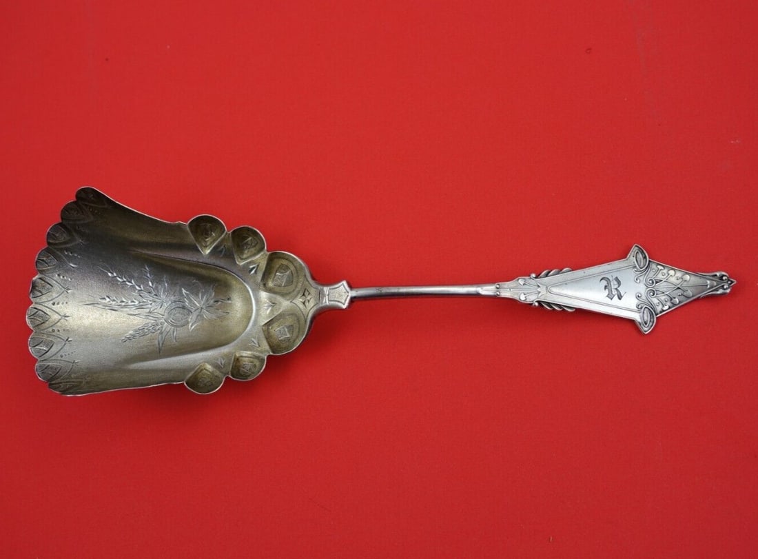 Knowles & Ladd Coral Sterling Silver Slotted Berry Spoon 9 3/4" Monogrammed: Knowles & Ladd Coral Sterling Silver Slotted Berry Spoon 9 3/4" Monogrammed This exquisite slotted berry spoon from the Coral pattern by Knowles and Ladd is crafted from high-quality sterling silver. 