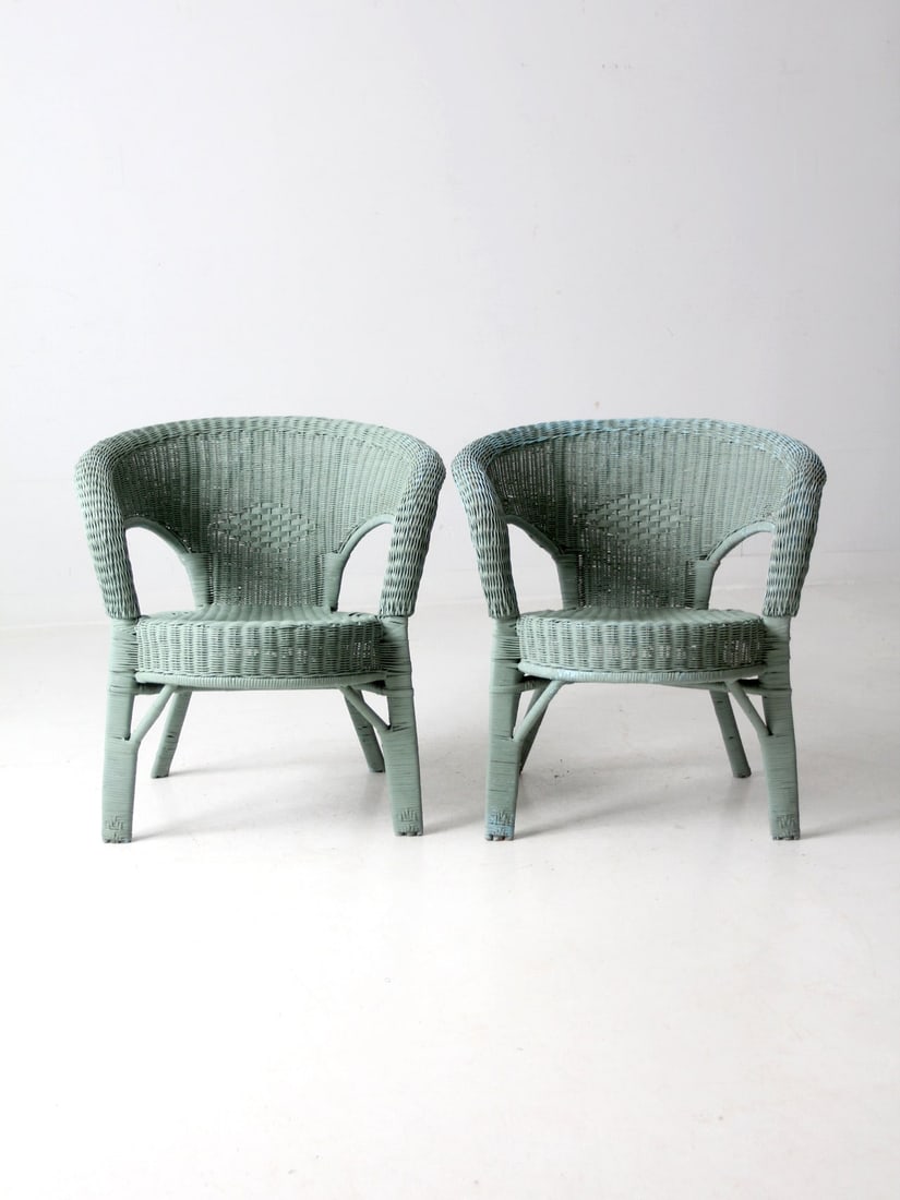 Charming Seafoam Green Vintage Wicker Chair Pair: Charming Seafoam Green Vintage Wicker Chair Pair This pair of vintage painted wicker chairs features a charming seafoam green tone, perfect for adding a touch of color to any space. The woven low back