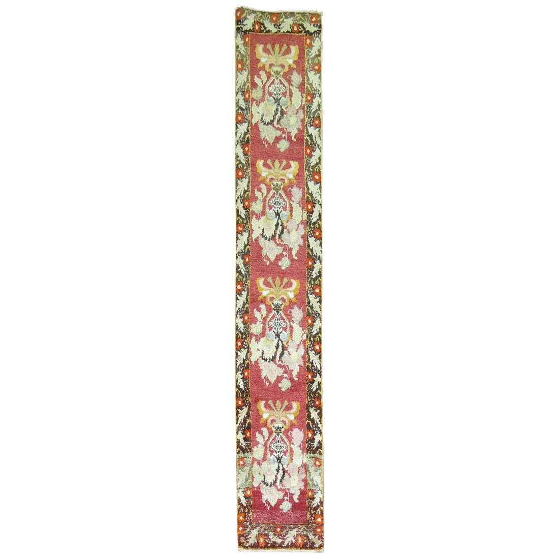 Mid Century Turkish Wool Floral Runner 21 x 118 in: Mid Century Turkish Wool Floral Runner 21 x 118 in This mid-20th century Turkish runner features a vibrant red field adorned with a repetitive large floral design. Hand-knotted from wool, it reflects 