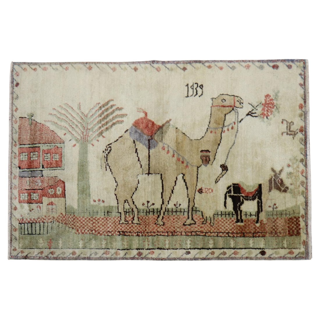 1939 Turkish Kula Scatter Rug Wool Camel Donkey Folk Art: 1939 Turkish Kula Scatter Rug Wool Camel Donkey Folk Art This exquisite Turkish Kula rug from the Zabihi Collection features a charming depiction of a camel and donkey set against an elegant ivory fie