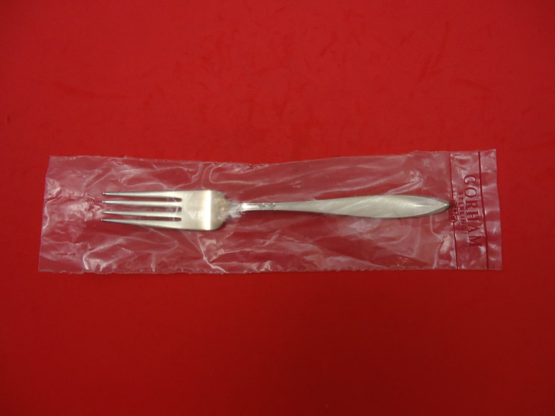 Gorham Gossamer Sterling Silver Regular Fork 7 3/8" New: Gorham Gossamer Sterling Silver Regular Fork 7 3/8" New Introducing the Gossamer by Gorham Regular Fork, crafted from high-quality sterling silver. This exquisite piece measures 7 3/8" and features th