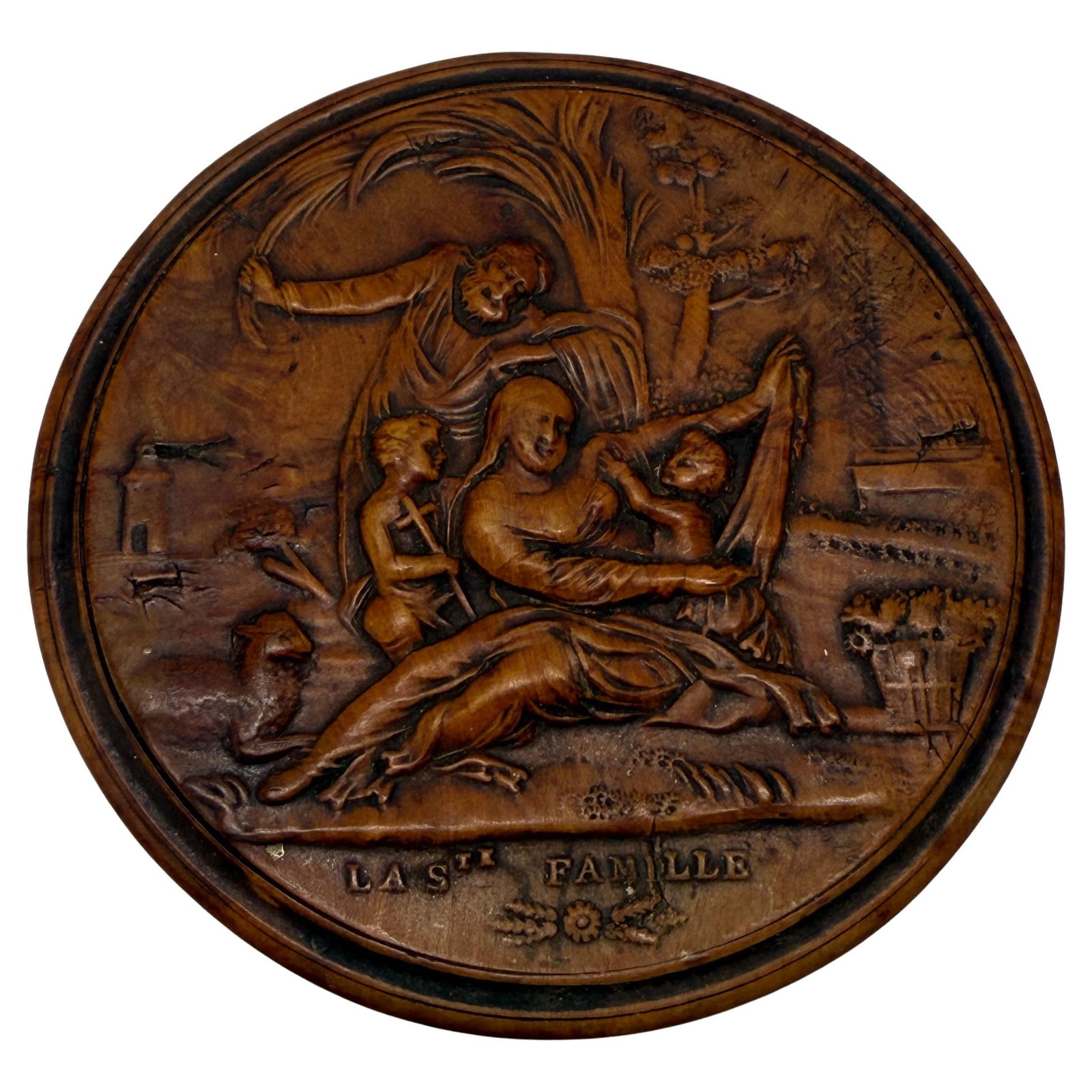 19th Century French Boxwood Snuff Box La Ste Famille: 19th Century French Boxwood Snuff Box La Ste Famille This exquisite early 19th-century French snuff box is a stunning example of Restauration art, meticulously carved from boxwood around 1820. The cir