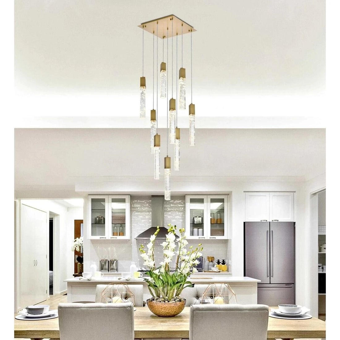 Aurora 9-Light Satin Gold Crystal Pendant Chandelier: Aurora 9-Light Satin Gold Crystal Pendant Chandelier This modern crystal chandelier pendant features a satin gold finish and is designed for indoor spaces such as dining rooms, living rooms, bedrooms,