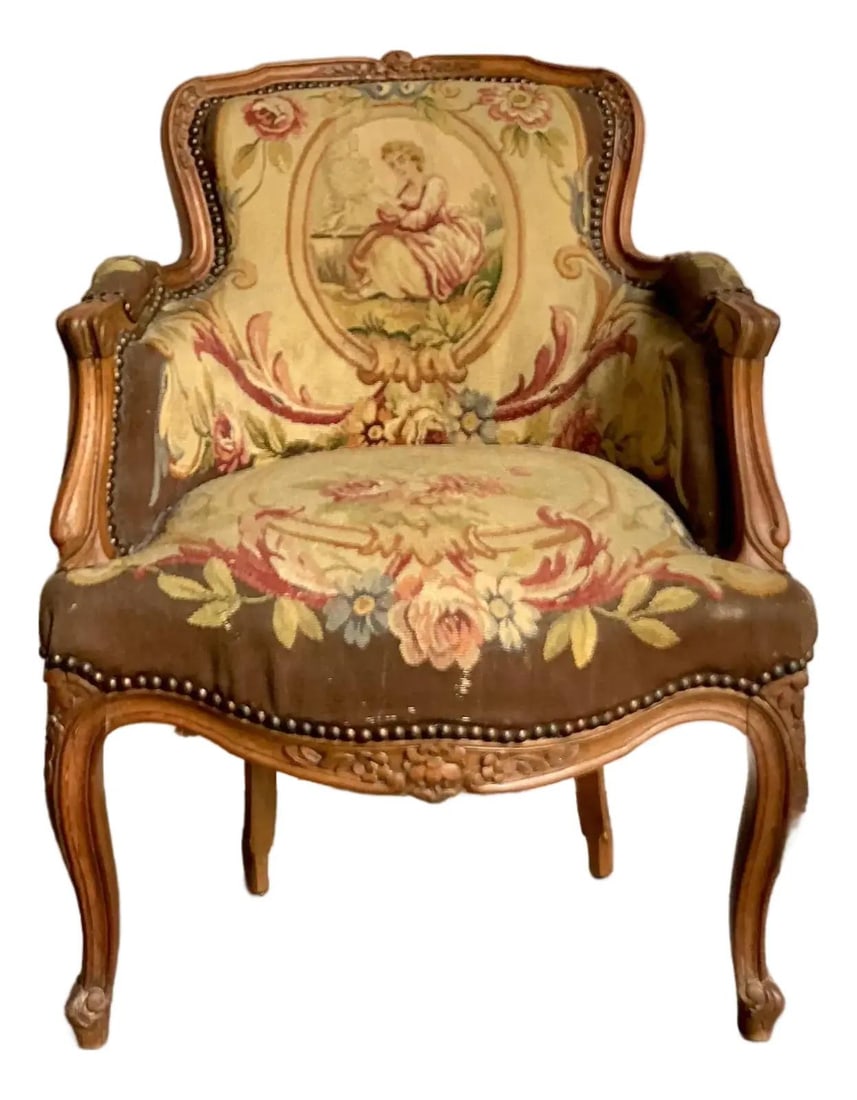 French Provincial Style Armchair With Vintage Tapestry and Carved Wood Frame: French Provincial Style Armchair With Vintage Tapestry and Carved Wood Frame This vintage Regency lounge chair embodies the French Provincial style with its elegantly carved wooden frame, scrolling ar