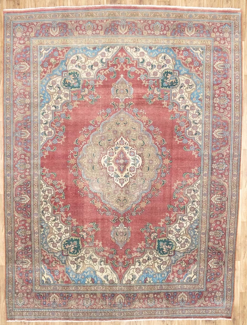 Hand-Knotted Wool Floral Vintage Area Rug 9'6 x 12'10: Hand-Knotted Wool Floral Vintage Area Rug 9'6 x 12'10 This semi-antique Oriental rug features a muted, distressed floral pattern in a blend of red, maroon, cream, blue, brown, yellow, and other subtle