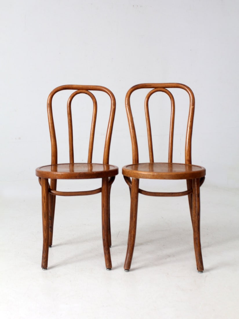 Pair of 1942 Vintage Bentwood Cafe Chairs by Northern Chair Co: Pair of 1942 Vintage Bentwood Cafe Chairs by Northern Chair Co This pair of vintage bentwood cafe chairs, dated 1942 and attributed to Northern Chair Co. of Chicago, showcases an elegant sculptural pr