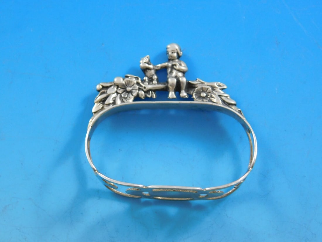 Labors of Cupid 835 Silver Napkin Ring Child Squirrel West Germany: Labors of Cupid 835 Silver Napkin Ring Child Squirrel West Germany This exquisite napkin ring features the enchanting 'Labors of Cupid' pattern, crafted from 835 silver and showcasing a delightful chi