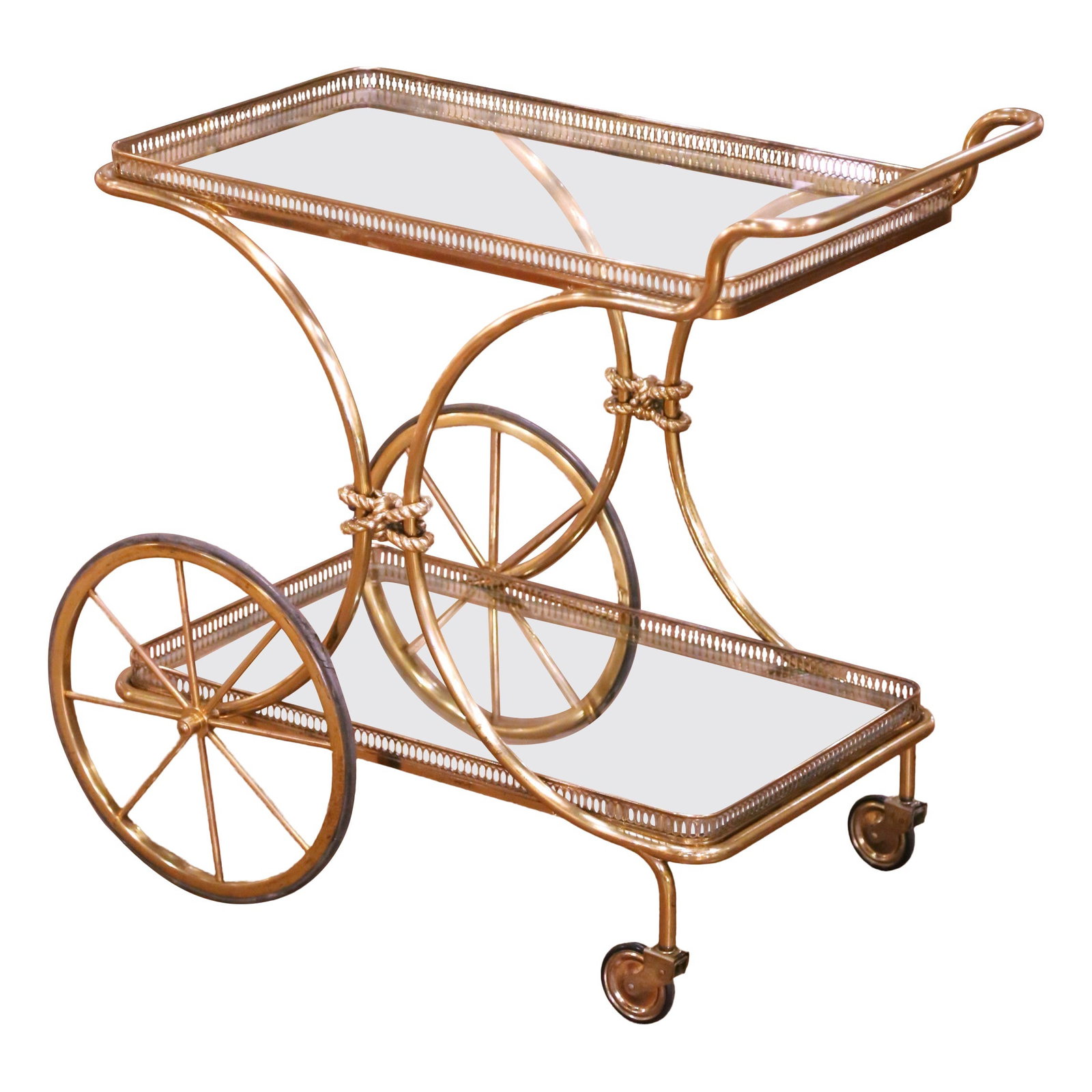 French Art Deco Gilt Brass Bar Trolley with Glass Shelves Mid-Century Design: French Art Deco Gilt Brass Bar Trolley with Glass Shelves Mid-Century Design This elegant mid-century French bar cart features a warm gilt-brass finish and showcases refined design from the mid-20th c