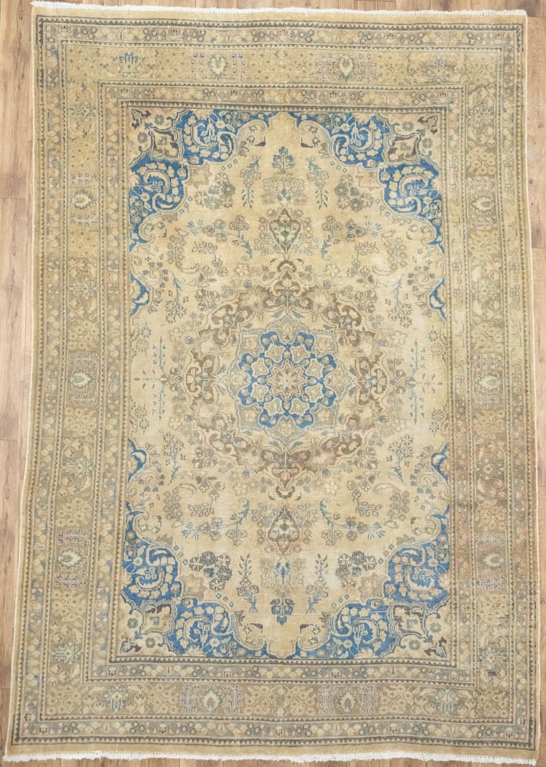 Hand Knotted Wool Floral Area Rug 6'3 x 9'3 Muted Vintage: Hand Knotted Wool Floral Area Rug 6'3 x 9'3 Muted Vintage This semi-antique hand-knotted Oriental wool rug features a muted color palette with shades of beige, brown, blue, and more. Crafted in the 19