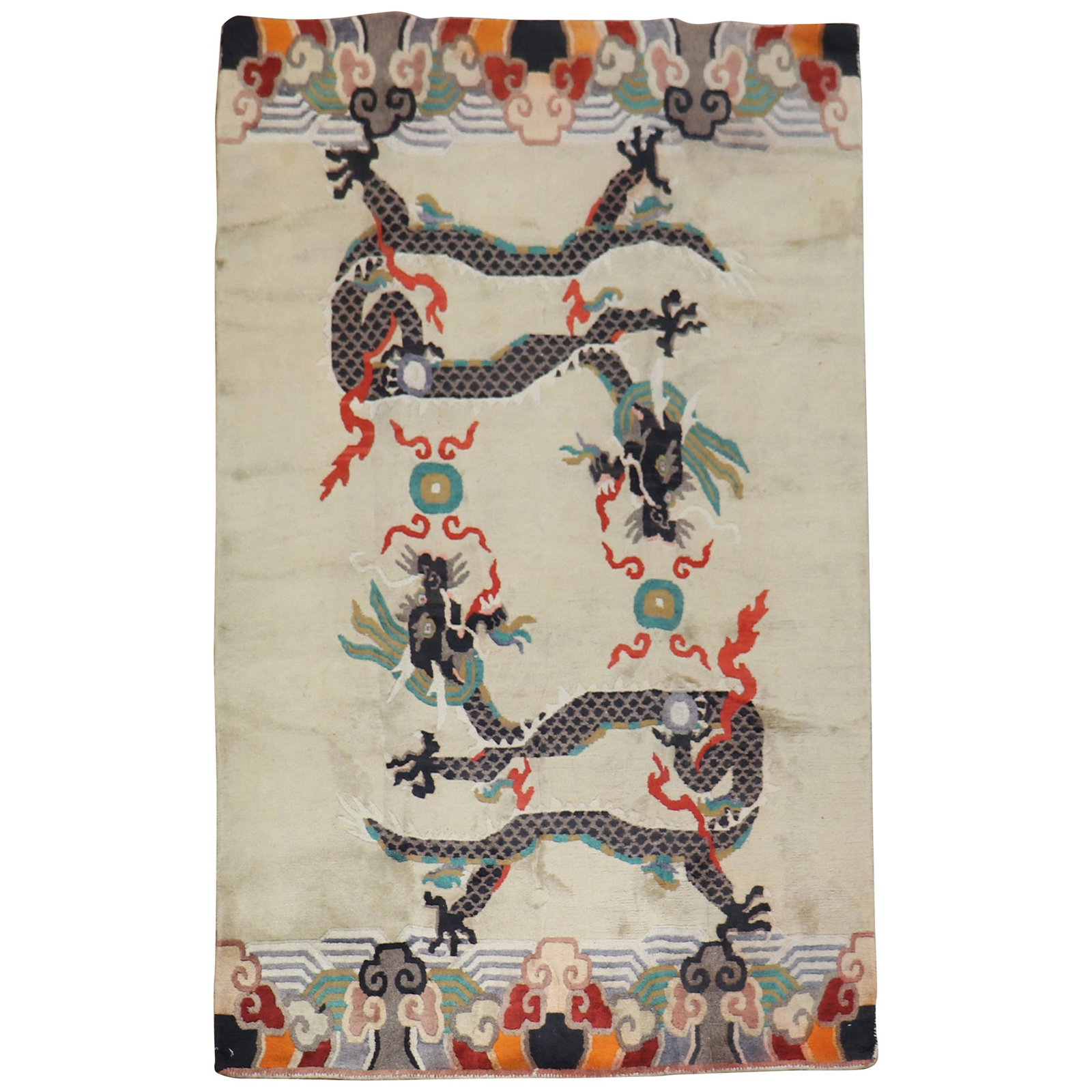 Vintage Tibetan Wool Rug with Dragon Motif 52 x 82 Hand-Woven: Vintage Tibetan Wool Rug with Dragon Motif 52 x 82 Hand-Woven Discover the elegance of this vintage Tibetan rug, showcasing a striking dragon motif set against a soft beige background. Hand-woven from