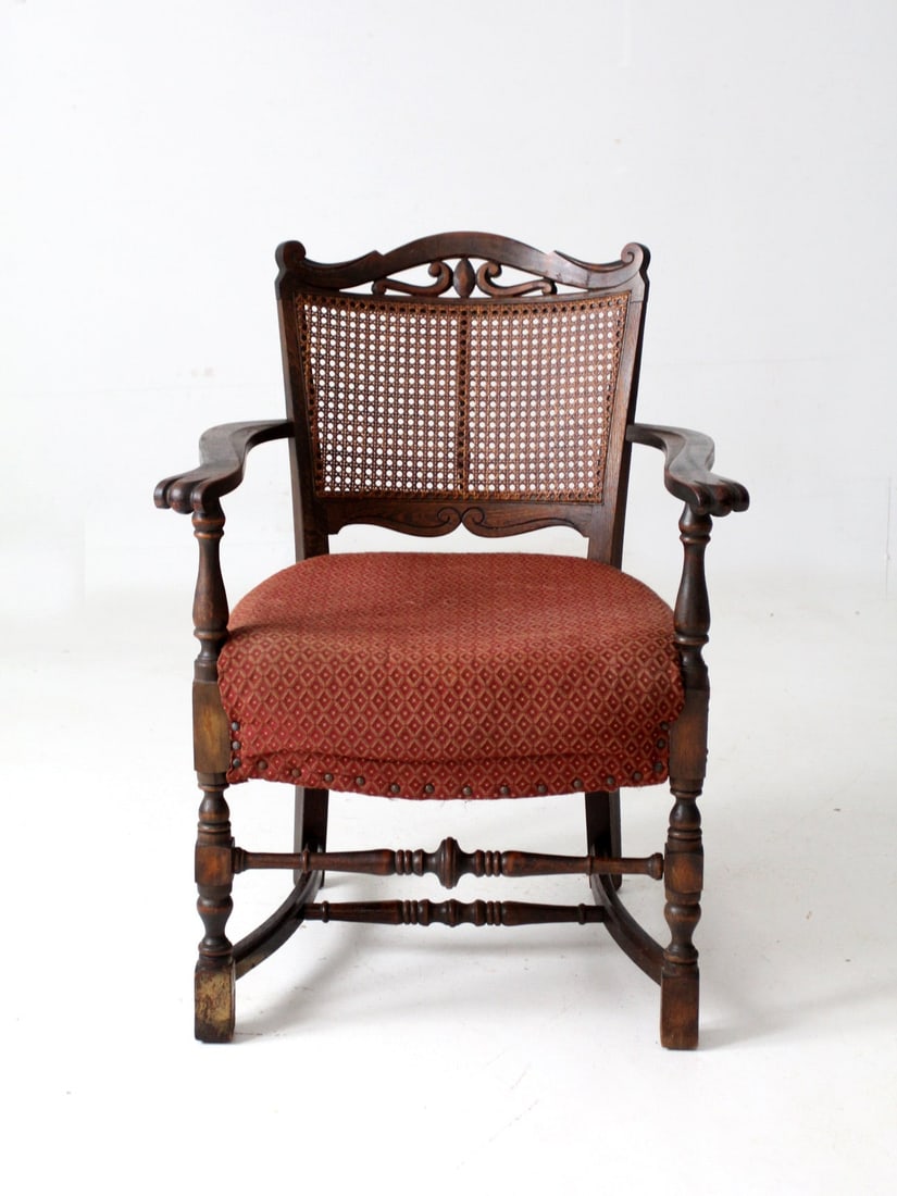 Antique Louis XIII Armchair with Caned Back and Upholstered Seat: Antique Louis XIII Armchair with Caned Back and Upholstered Seat This exquisite antique Louis XIII style armchair showcases a beautiful caned back and an upholstered seat, making it a stunning accent 