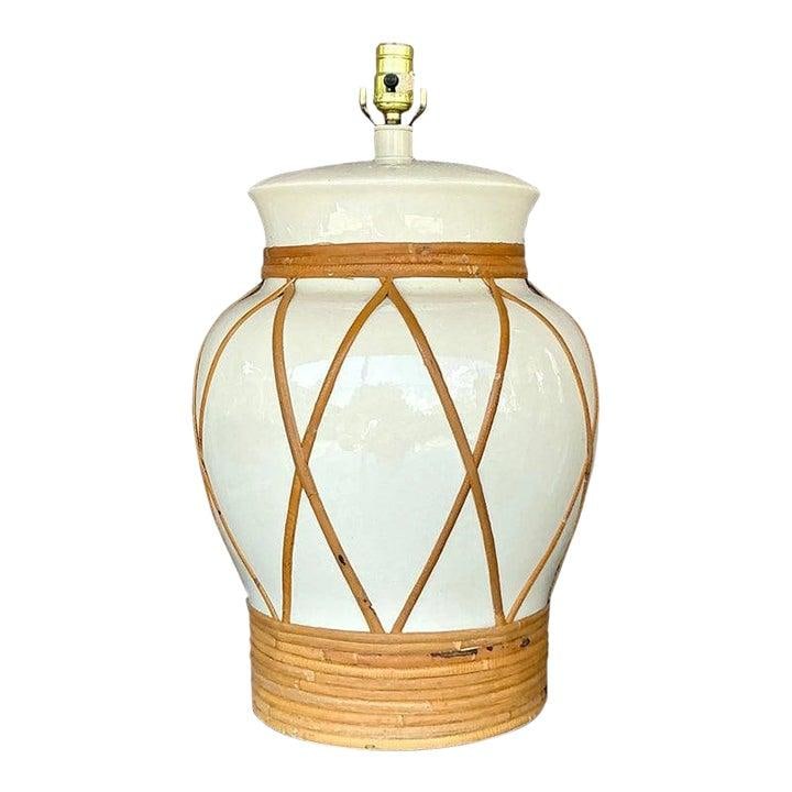Vintage Boho Rattan Wrapped Urn Lamp 21 Inches Tall: Vintage Boho Rattan Wrapped Urn Lamp 21 Inches Tall Enhance your living space with this Vintage Boho Monumental Rattan Wrapped Urn Lamp. This lamp showcases a beautifully curved ceramic base finished 