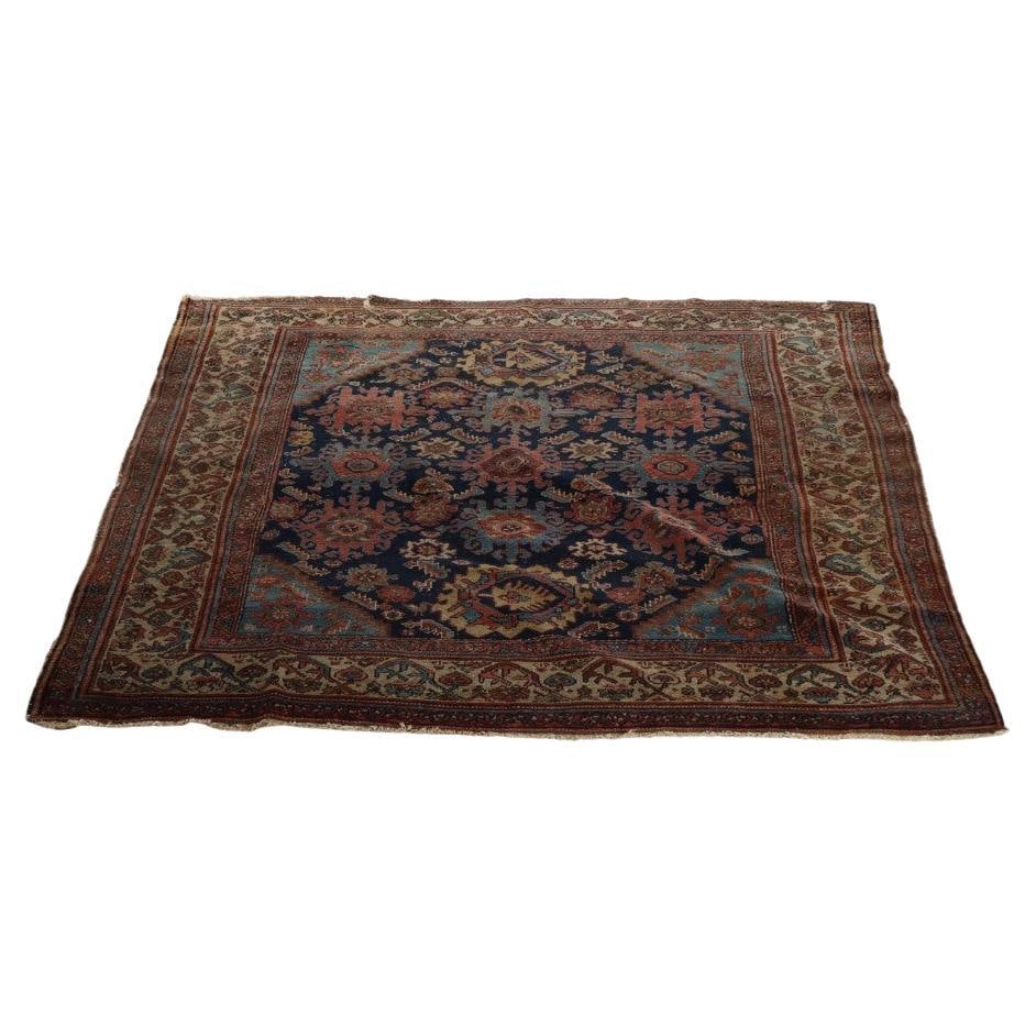 Early 20th Century Persian Mahal Wool Rug 68 x 60.5 Inches: Early 20th Century Persian Mahal Wool Rug 68 x 60.5 Inches This antique Mahal Persian area rug from circa 1910 features a central medallion surrounded by floral motifs and geometric patterns, all set 