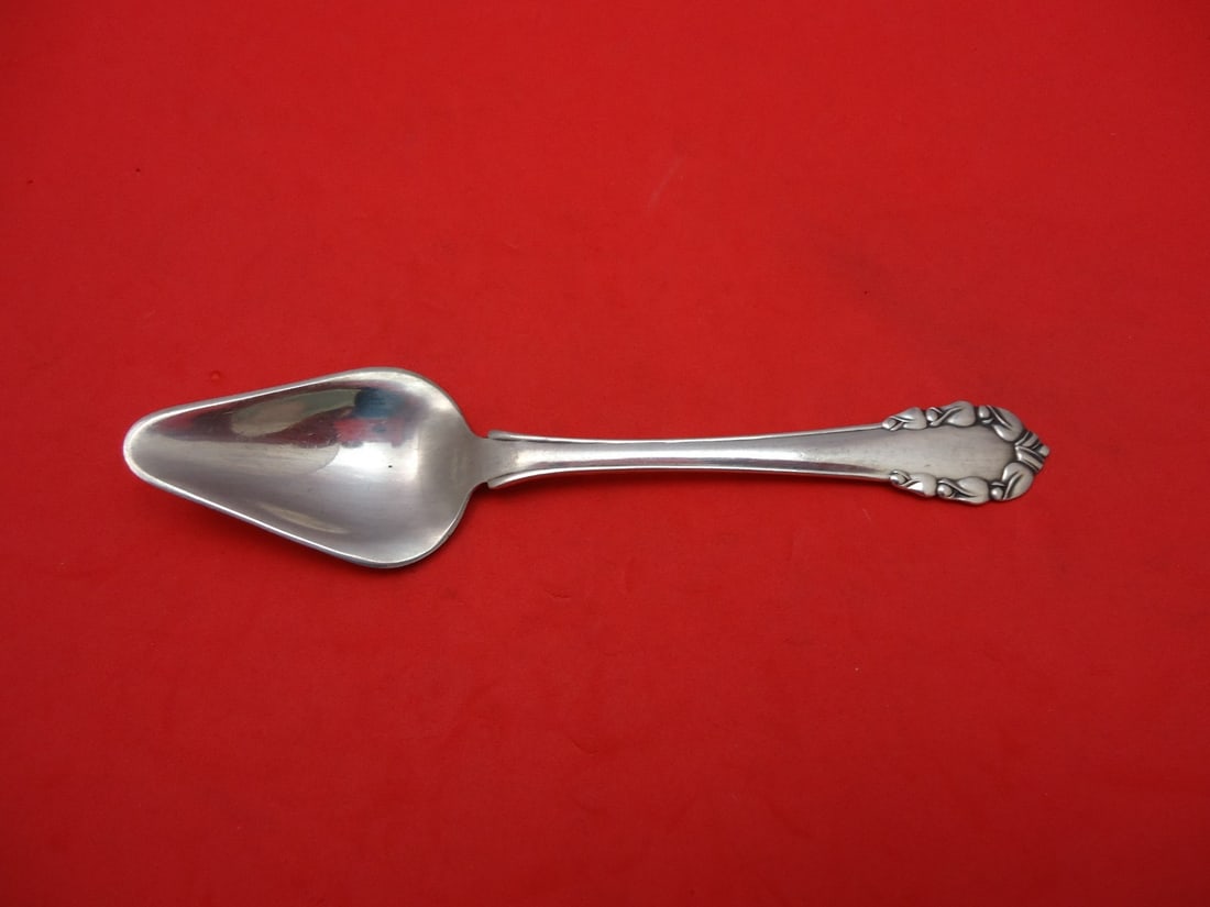 Georg Jensen Lily of the Valley Sterling Silver Melon Spoon 5 3/4": Georg Jensen Lily of the Valley Sterling Silver Melon Spoon 5 3/4" Discover the elegance of the Lily of the Valley melon spoon by Georg Jensen, crafted from high-quality sterling silver. This