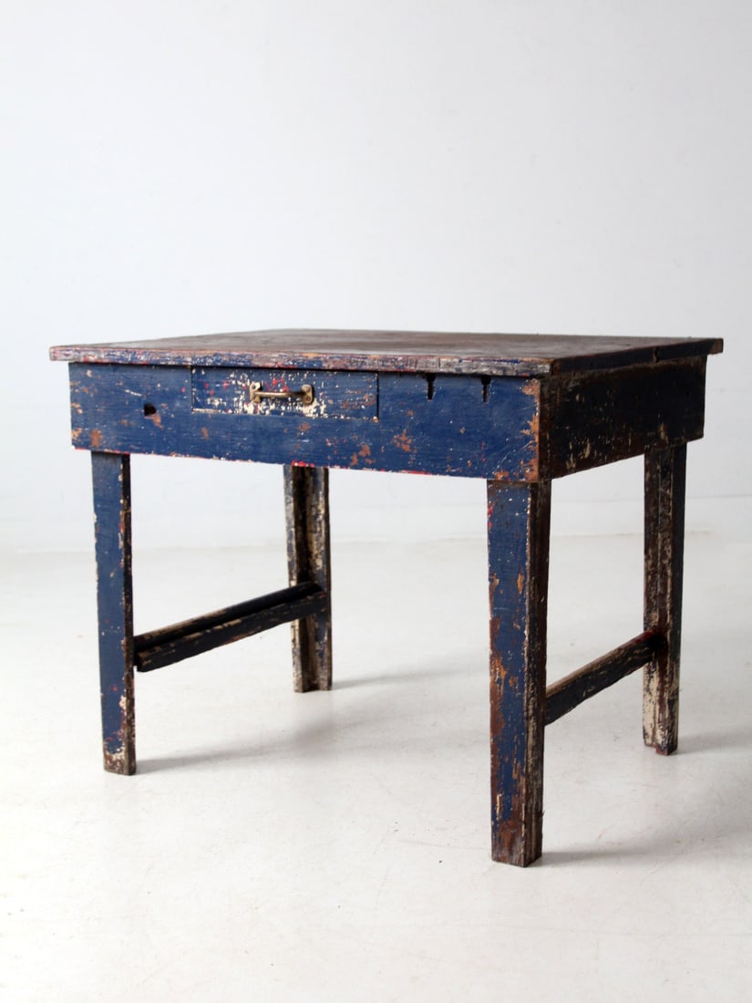 Rustic Antique Farmhouse Work Table with Blue Frame and Drawer: Rustic Antique Farmhouse Work Table with Blue Frame and Drawer This antique farmhouse work table showcases a rustic two-plank wood top complemented by a charming painted blue frame, offering a vibrant