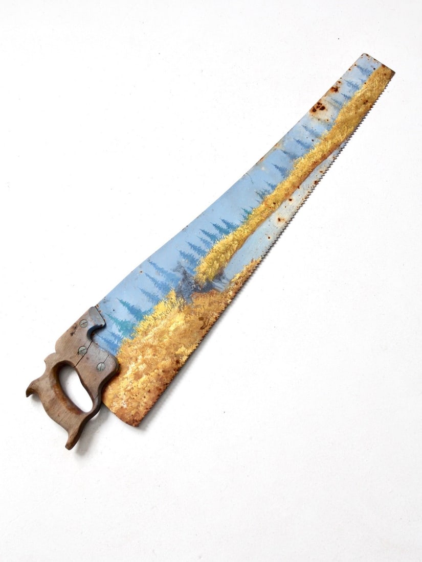 Vintage Folk Art Deer Scene on Warranted Superior Hand Saw: Vintage Folk Art Deer Scene on Warranted Superior Hand Saw This vintage folk art piece features a hand-painted scene of deer in a river landscape, artfully crafted on a Warranted Superior hand saw. Th