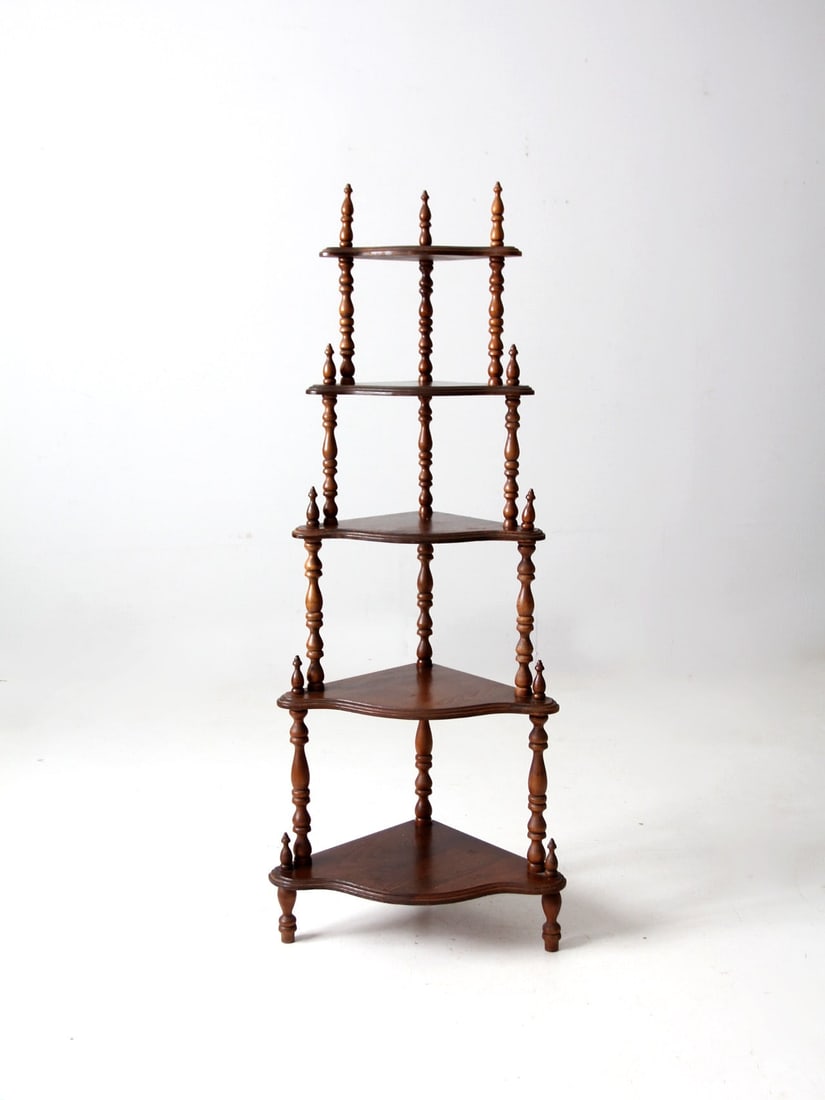 Vintage Wooden Corner Shelf with Stick and Ball Detailing: Vintage Wooden Corner Shelf with Stick and Ball Detailing This antique corner shelf features a charming design with five wooden shelves and intricate stick and ball detailing. Its elegant structure ma