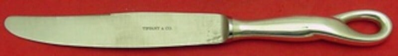 Tiffany & Co Padova Sterling Silver Dinner Knife 9.5 Inch: Tiffany & Co Padova Sterling Silver Dinner Knife 9.5 Inch Introducing the Padova dinner knife by Tiffany & Co., a stunning piece of sterling silverware that exemplifies timeless elegance. Crafted with