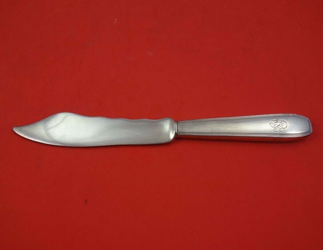 Tiffany & Co Reeded Edge Sterling Silver Fish Knife 7 3/4": Tiffany & Co Reeded Edge Sterling Silver Fish Knife 7 3/4" Presenting a stunning Reeded Edge Fish Knife by Tiffany & Co., crafted from premium sterling silver. This exquisite piece features a hollow