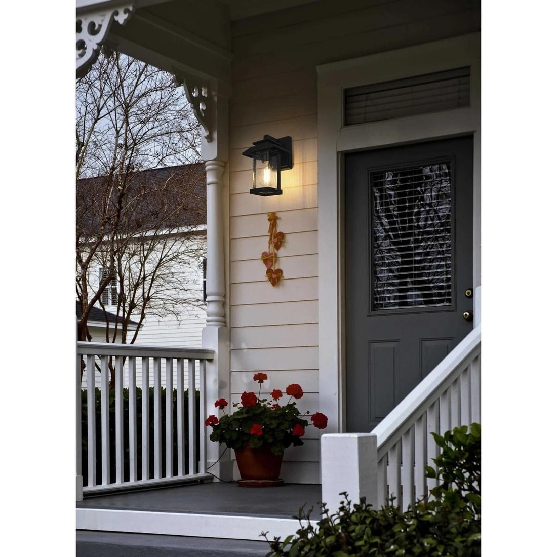 Tioga Black Iron Glass Wall Sconce 12 Inch Outdoor Light: Tioga Black Iron Glass Wall Sconce 12 Inch Outdoor Light This outdoor wall sconce light fixture features a classic black finish with seedy glass, offering a traditional look suitable for patios,
