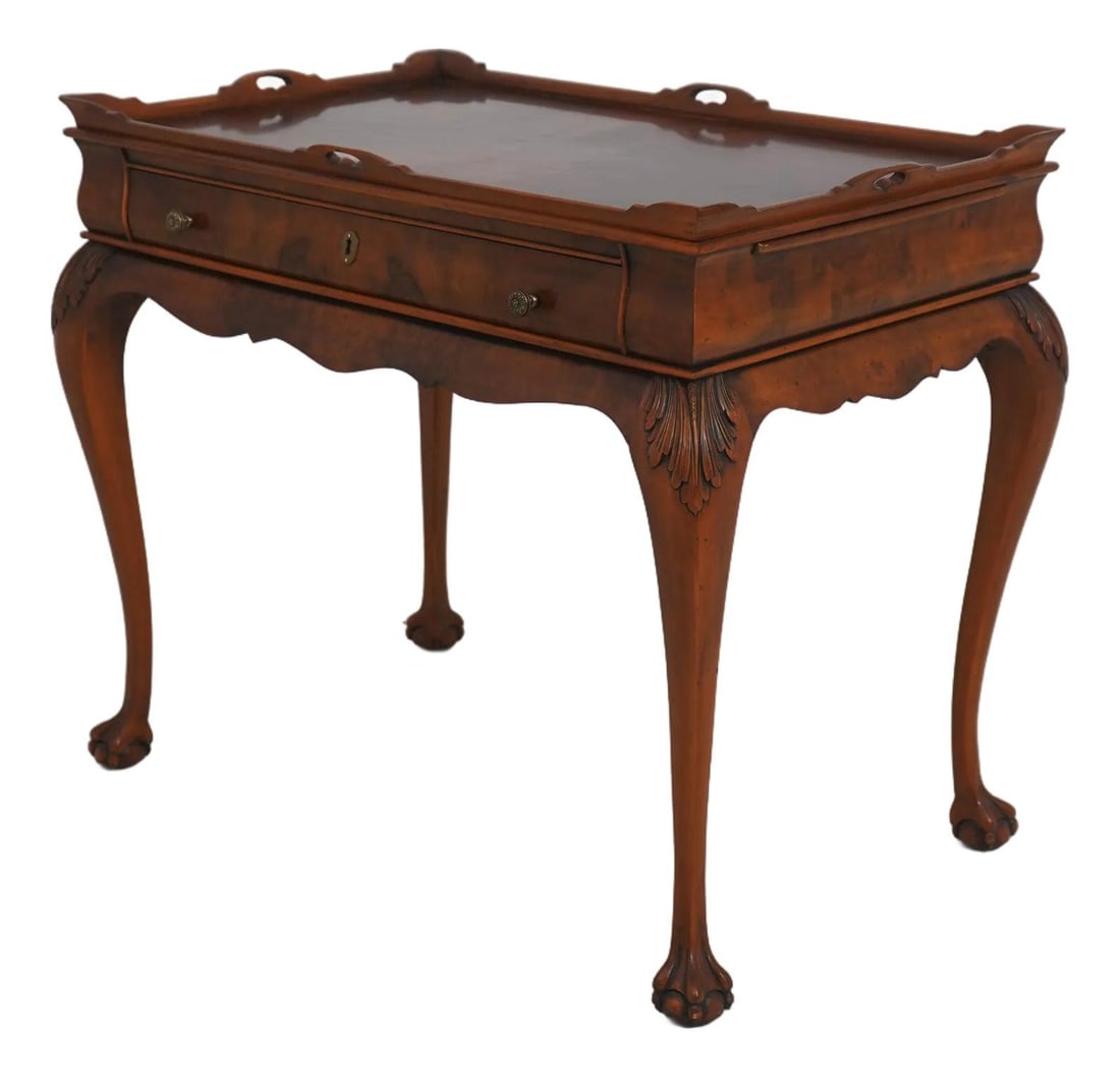 Vintage Olivewood Veneer Tea Table with Ball and Claw Feet Chippendale Influence: Vintage Olivewood Veneer Tea Table with Ball and Claw Feet Chippendale Influence This Italian Chippendale style tea table features elegant ball and claw feet, a dovetailed drawer, and intricate carved