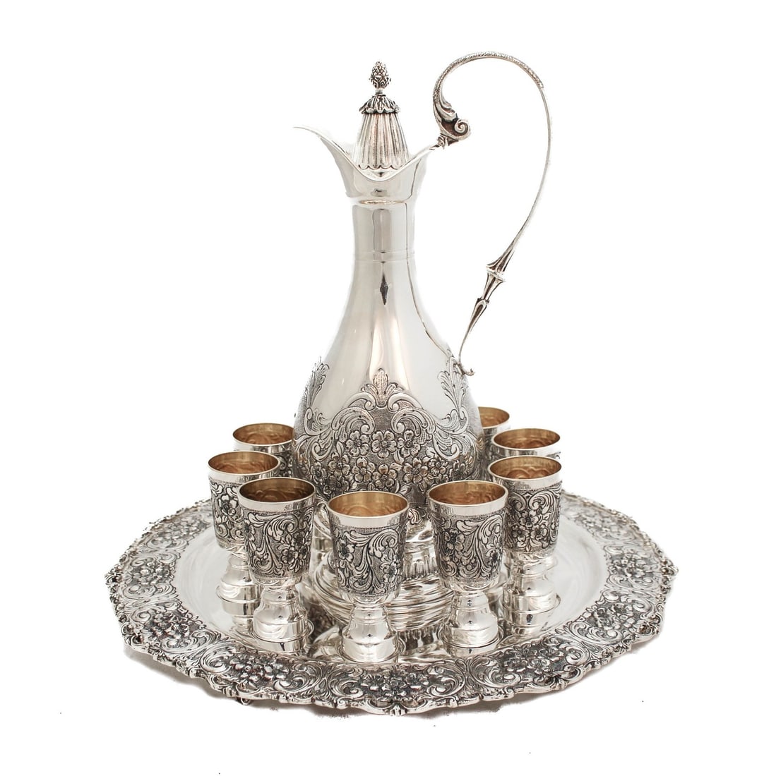 Italian Sterling Silver Liquor Set with Tray Pitcher and Twelve Ornate Cups: Italian Sterling Silver Liquor Set with Tray Pitcher and Twelve Ornate Cups This fine Italian liquor set is crafted from 925 sterling silver and includes a pitcher, a tray, and twelve cups. Each piece