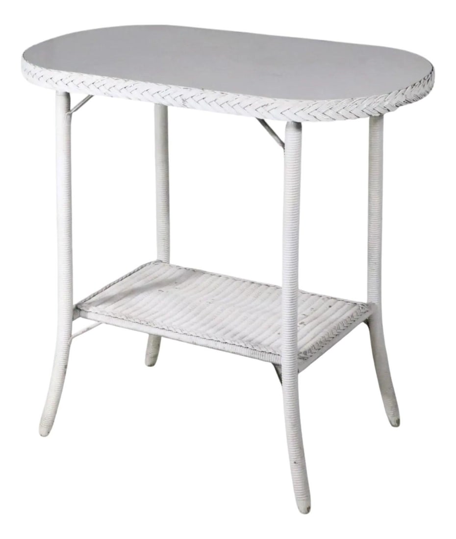 Lloyd Loom Attributed White Wicker Oval Side Table: Lloyd Loom Attributed White Wicker Oval Side Table This vintage oval white wicker side table is attributed to the Lloyd Loom Furniture Company and dates from the 1930s to 1950s. It features an oval to