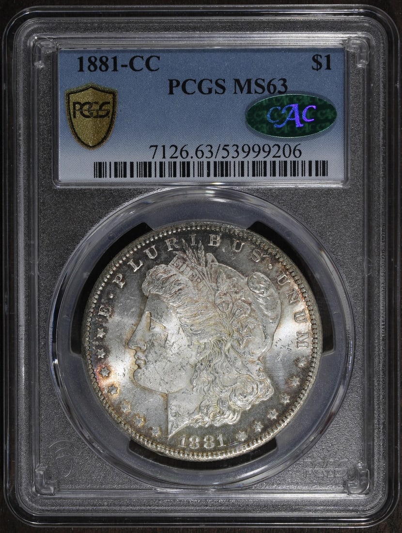 PCGS MS63 CAC 1881-CC Morgan Silver Dollar Carson City Key Date: PCGS MS63 CAC 1881-CC Morgan Silver Dollar Carson City Key Date This is an 1881-CC Morgan Silver Dollar graded MS63 by PCGS, designated as a key date from the Carson City Mint. The coin is composed of