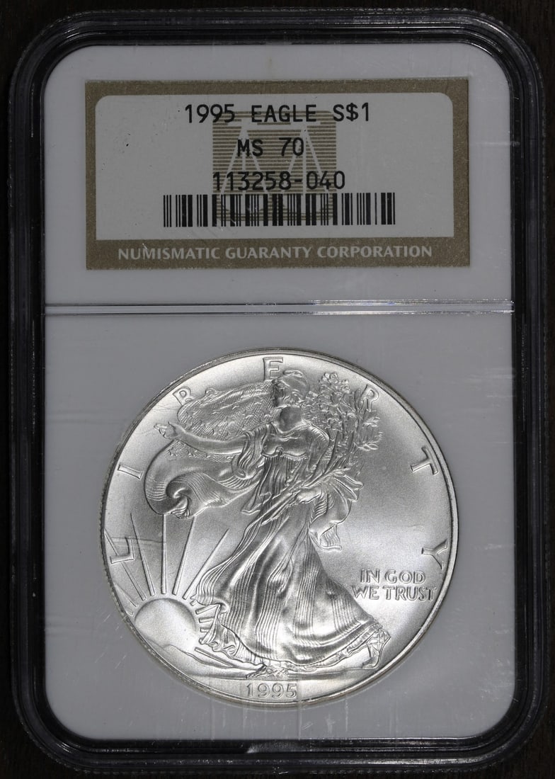 NGC MS70 1995 Silver Eagle Dollar Coin: NGC MS70 1995 Silver Eagle Dollar Coin This 1995 American Silver Eagle coin features a composition of .999 fine silver and contains 1 ounce of precious metal. Graded MS 70 by NGC, the coin is in pre-o