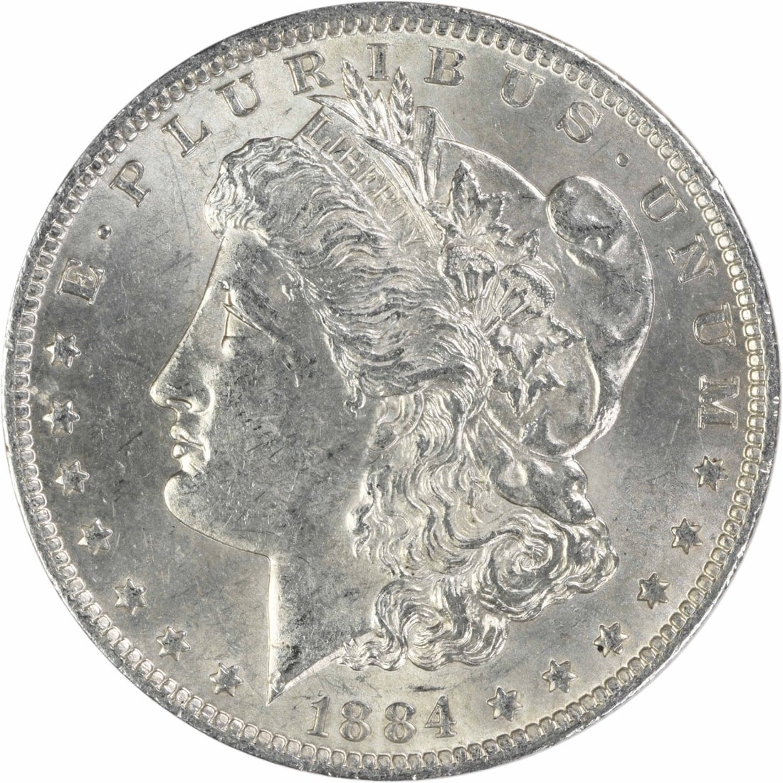 1884 O Morgan Dollar AU Uncertified Silver Coin: 1884 O Morgan Dollar AU Uncertified Silver Coin This 1884-O Morgan Silver Dollar is an uncirculated coin graded as About Uncirculated (AU). It is composed of 90% silver and 10% copper, minted in New O