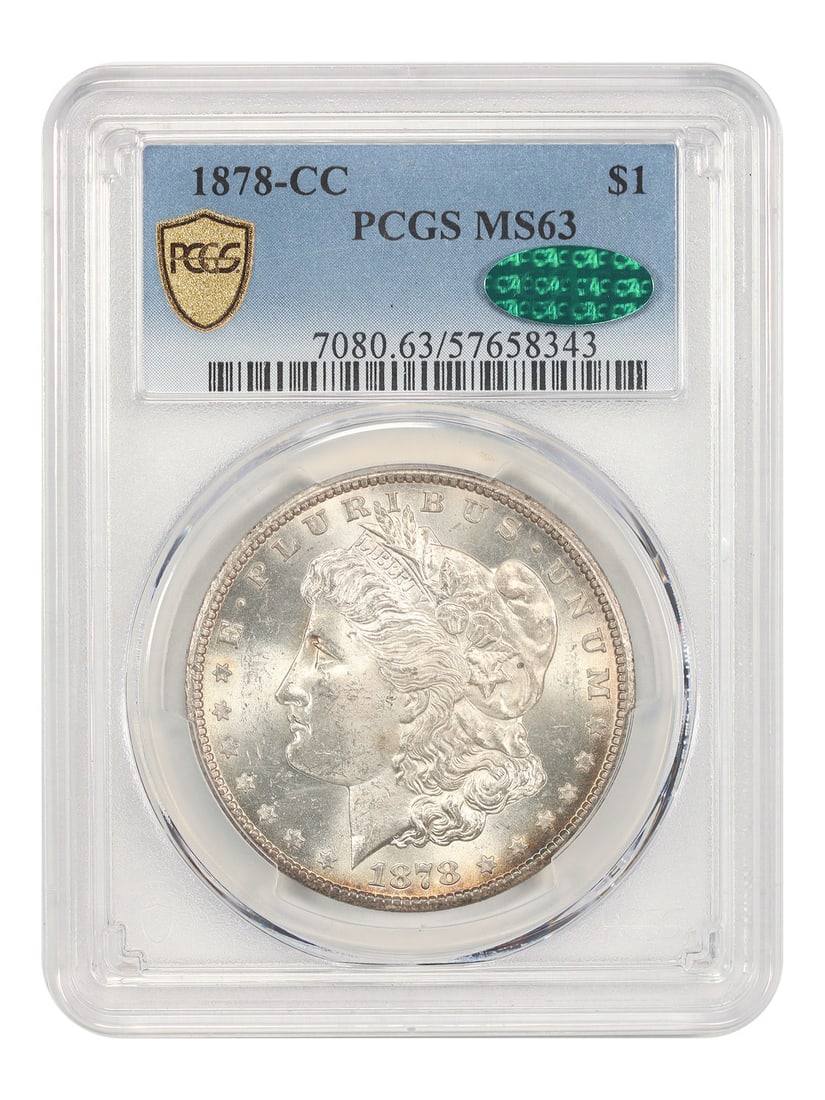 1878 Carson City Morgan Dollar PCGS CAC MS63: 1878 Carson City Morgan Dollar PCGS CAC MS63 This is an 1878-CC Morgan Dollar graded MS63 by PCGS and approved by CAC. Struck in Carson City, this coin represents the first year of the Morgan Dollar s