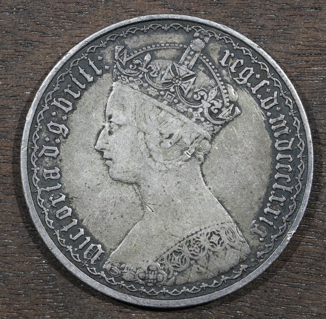 1879 British Silver Two Shillings Gothic Florin: 1879 British Silver Two Shillings Gothic Florin This is an 1879 Great Britain Gothic Florin, also known as a Two Shillings coin. The coin is composed of silver and has been circulated. It is offered i