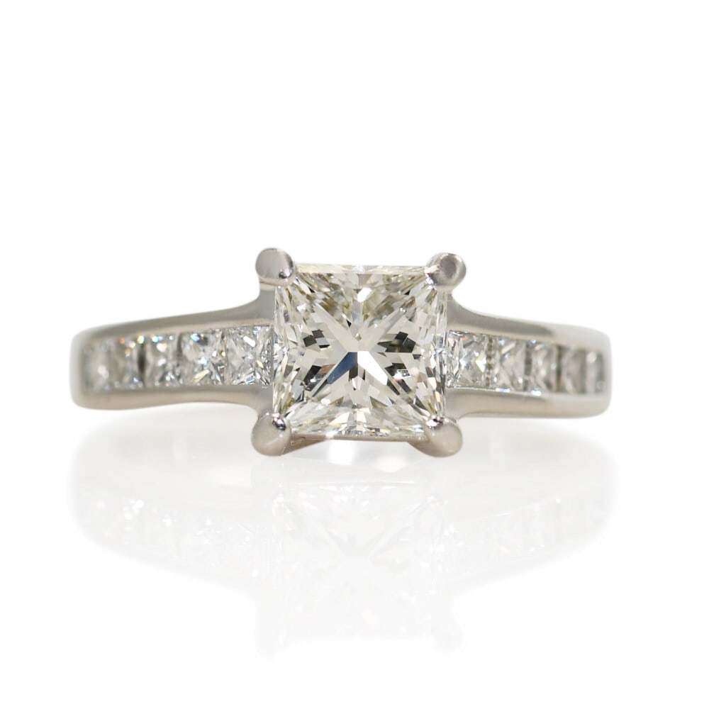 GIA Certified Platinum Princess Diamond Engagement Ring Size 4.25: GIA Certified Platinum Princess Diamond Engagement Ring Size 4.25 This ladies' engagement ring features a platinum mounting with a total weight of 5.4 grams. The centerpiece is a natural princess-cut 
