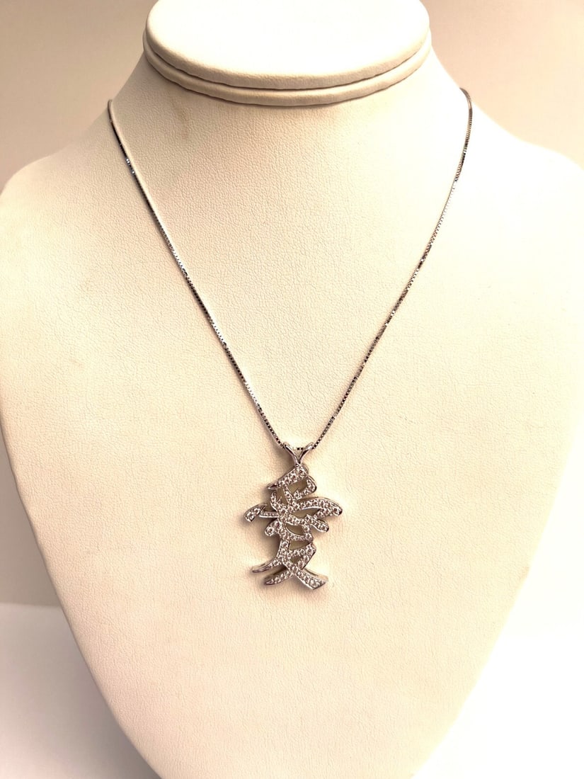 18K White Gold Diamond Love Pendant Necklace by Dankner: 18K White Gold Diamond Love Pendant Necklace by Dankner This exquisite necklace-pendant is crafted from 18K white gold and features a stunning Chinese character symbolizing 'Love.' Designed by Dankner