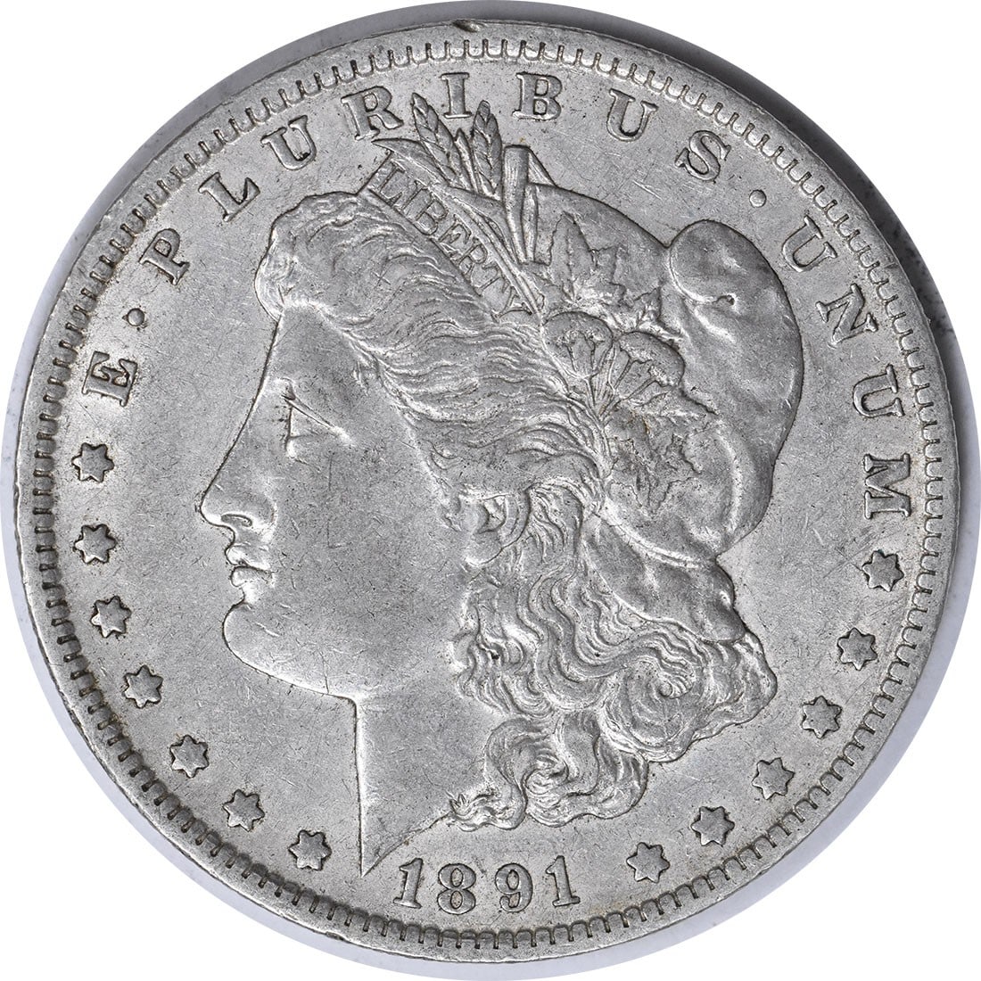 1891-O Morgan Silver Dollar Uncertified Coin by George T. Morgan: 1891-O Morgan Silver Dollar Uncertified Coin by George T. Morgan This 1891-O Morgan Silver Dollar is a classic piece of American numismatics, showcasing a design by George T. Morgan. The coin features