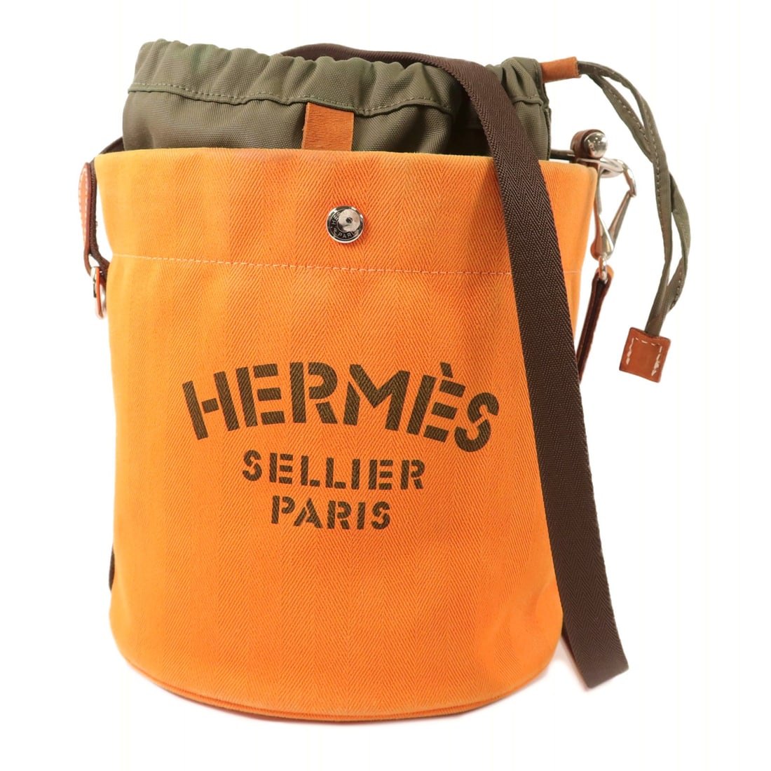 Hermes Orange Canvas Grooming Bucket Shoulder Bag PHW: Hermes Orange Canvas Grooming Bucket Shoulder Bag PHW This Hermes PHW Sac De Pansage Grooming Bucket Shoulder Bag features a vibrant orange canvas exterior and is designed for unisex use. Made in Fran
