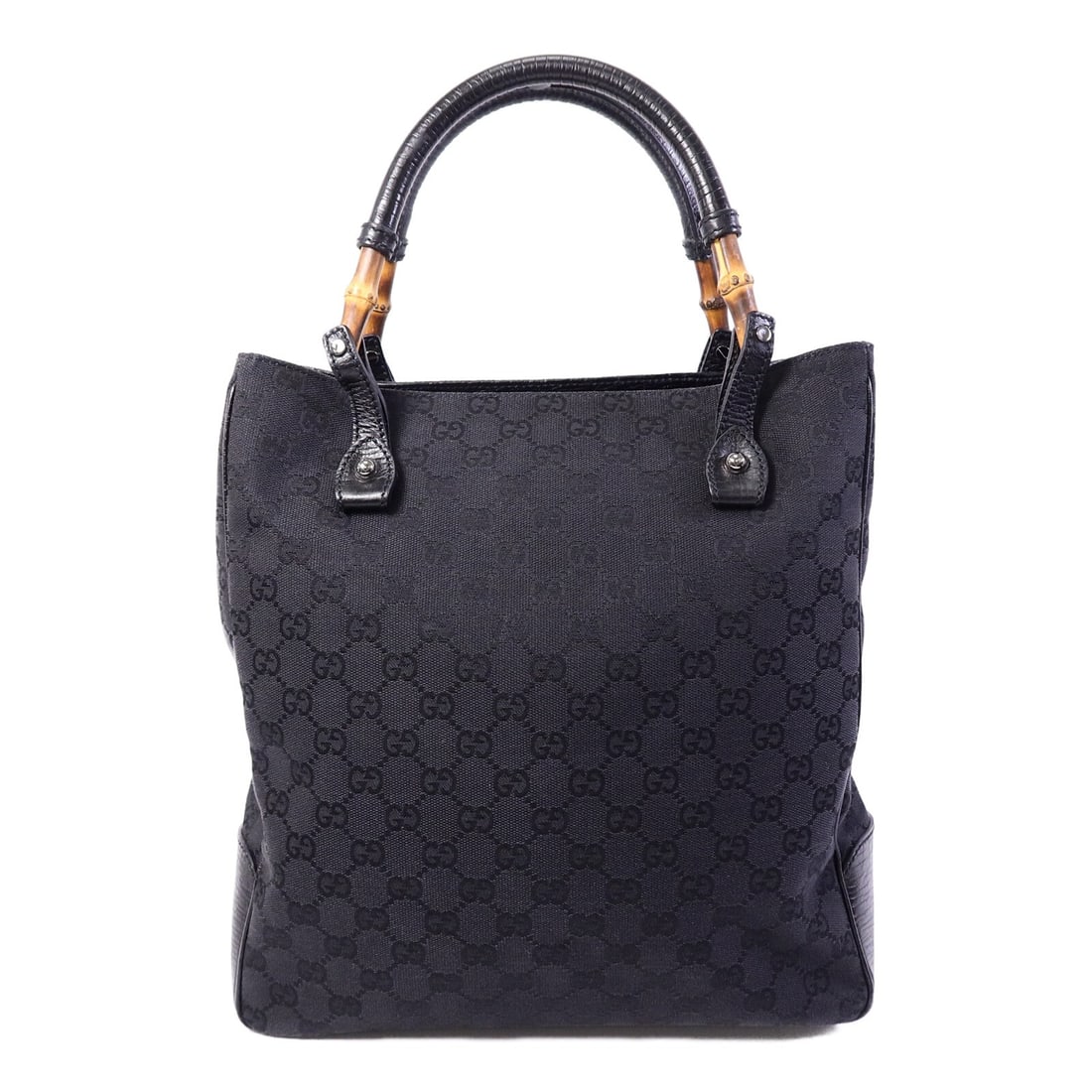 Gucci 112530 Black Canvas Handbag: Gucci 112530 Black Canvas Handbag This Gucci handbag features a classic black canvas exterior with silver-tone hardware, offering a sophisticated and versatile look. Designed for women, it provides am