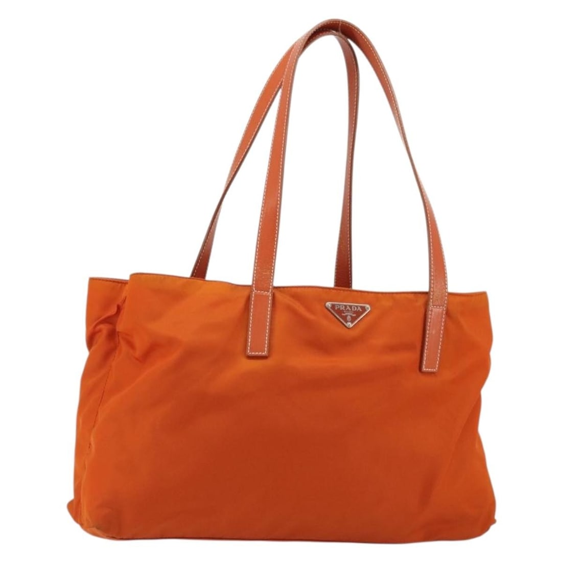 Orange Nylon Prada Vintage Tote Bag: Orange Nylon Prada Vintage Tote Bag This Prada Vintage Tote is crafted from orange nylon and features a spacious design suitable for everyday use. Made in Italy, it is tailored for women and showcases