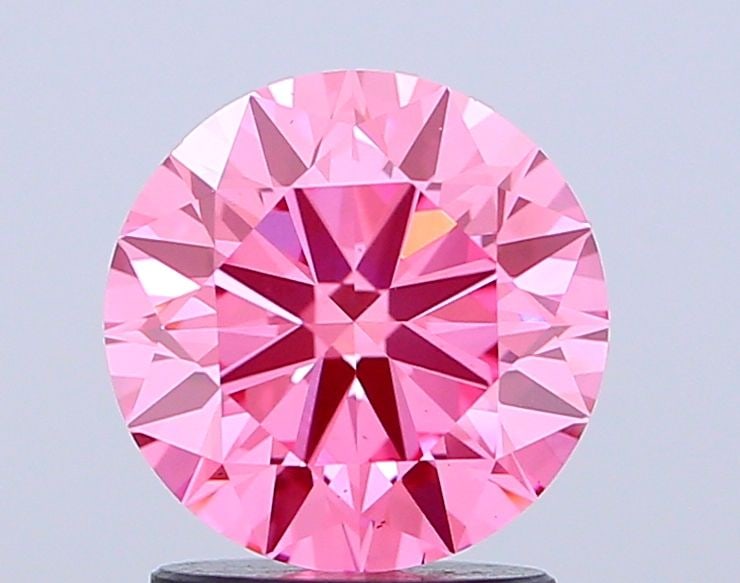 Ideal Loose Diamond - ROUND 2.01ct Fancy Vivid Pink VS1: Ideal Loose Diamond - ROUND 2.01ct Fancy Vivid Pink VS1 Source: This is a real non-mined Diamond that has been grown in a lab Shape: ROUND Carats: 2.01 Color: Fancy Vivid Pink Certification: IGI Video
