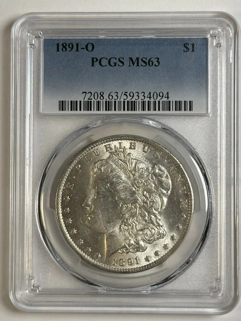 1891 New Orleans Morgan Dollar PCGS MS63 Silver: 1891 New Orleans Morgan Dollar PCGS MS63 Silver This 1891 Morgan Silver Dollar was minted in New Orleans and is graded MS-63 by PCGS. Composed of silver, this uncirculated coin is a desirable addition