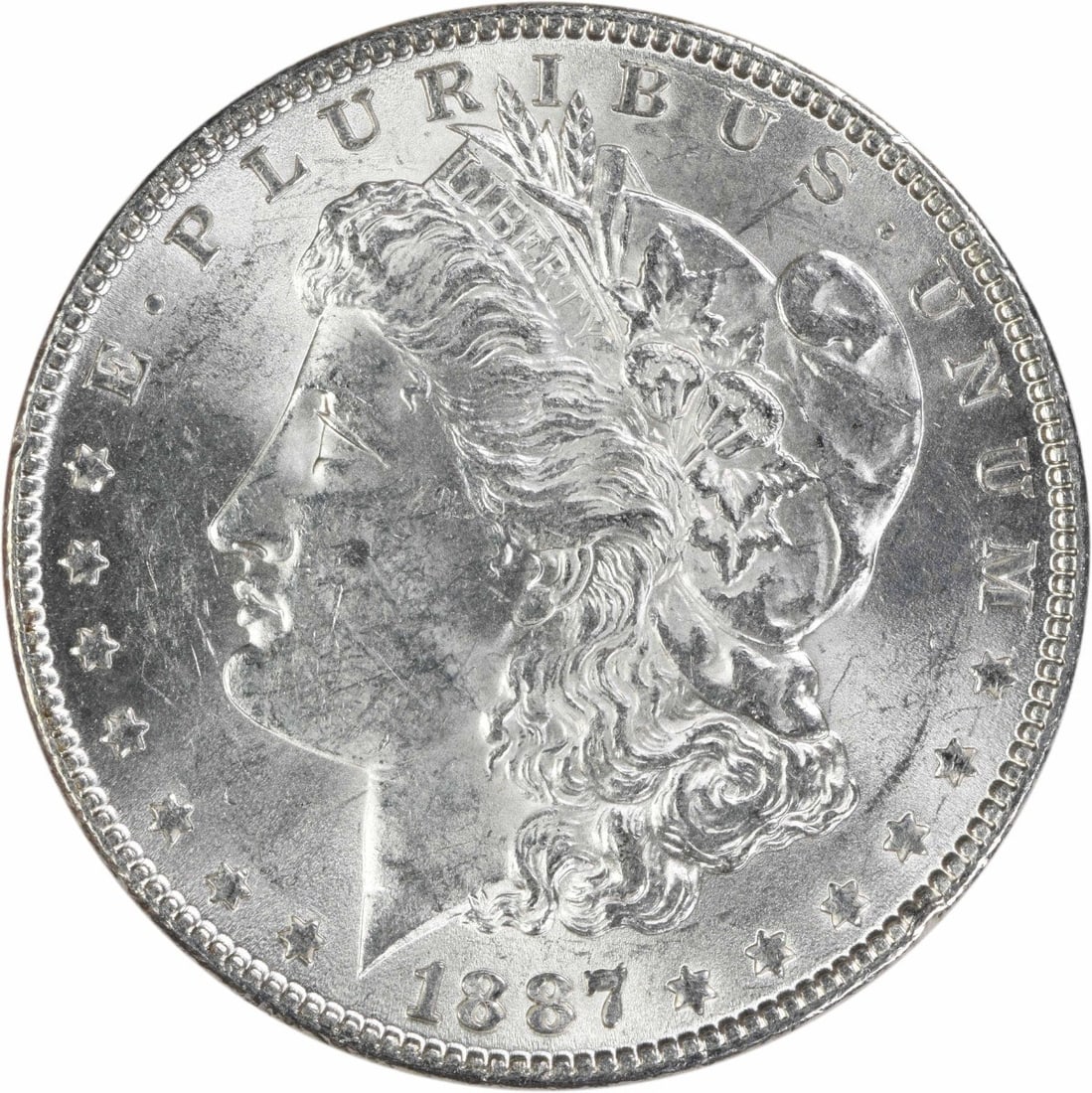 1887 Philadelphia Morgan Dollar 90% Silver AU Uncertified: 1887 Philadelphia Morgan Dollar 90% Silver AU Uncertified This 1887 Morgan Silver Dollar is an attractive example of this classic U.S. coin. Struck at the Philadelphia Mint, it is composed of 90% silv