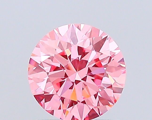 Ideal Loose Diamond - ROUND 1.04ct Fancy Vivid Pink VS1: Ideal Loose Diamond - ROUND 1.04ct Fancy Vivid Pink VS1 Source: This is a real non-mined Diamond that has been grown in a lab Shape: ROUND Carats: 1.04 Color: Fancy Vivid Pink Certification: IGI Video