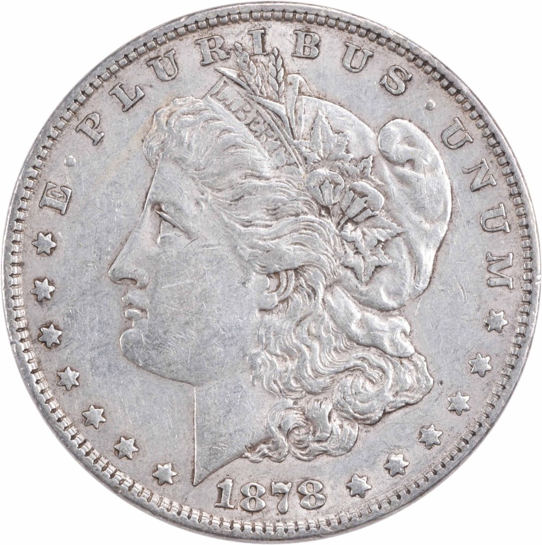 1878 Morgan Silver Dollar AU Uncertified by George T. Morgan: 1878 Morgan Silver Dollar AU Uncertified by George T. Morgan This 1878 Morgan Silver Dollar is a classic piece of American history, featuring a design by George T. Morgan. The coin is composed of 90% 