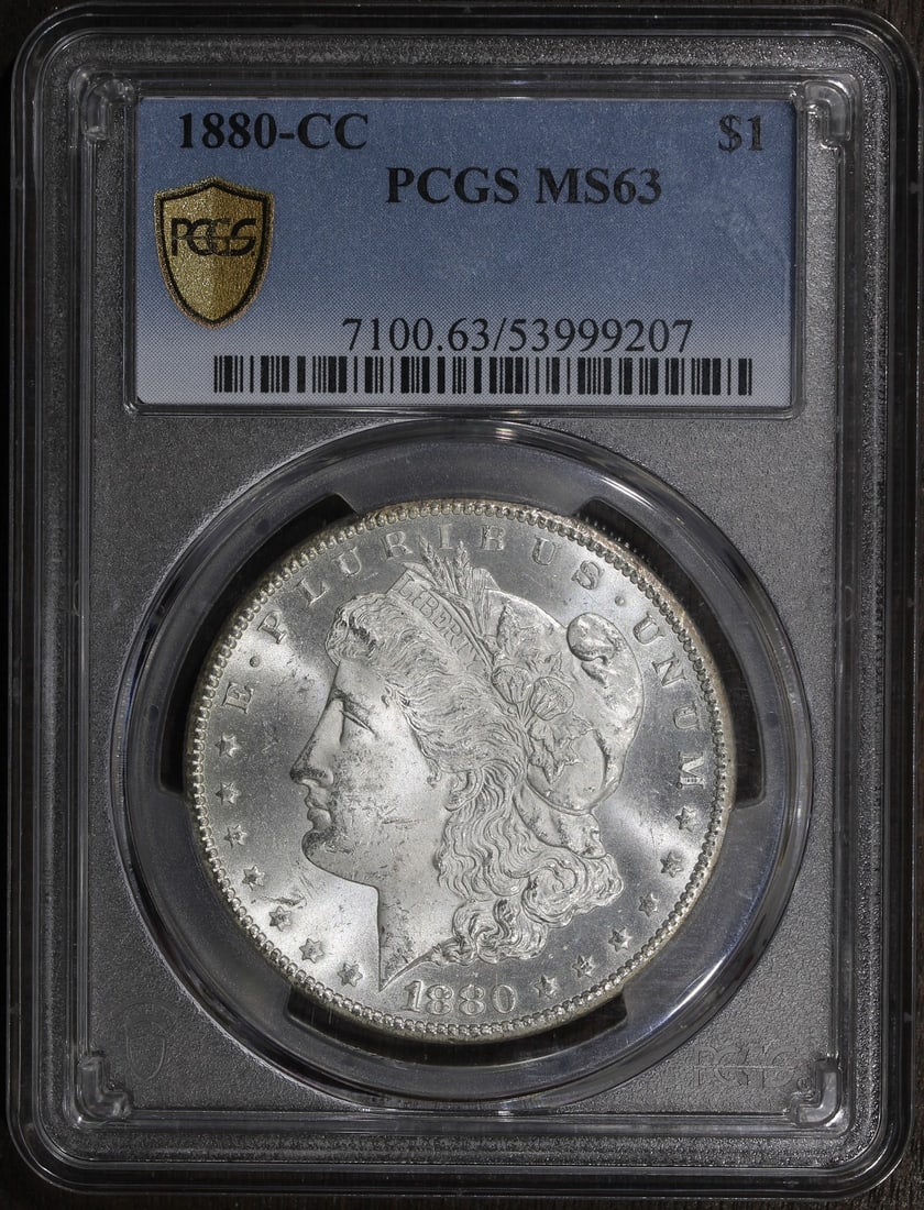 PCGS MS63 Carson City Morgan Silver Dollar 1880-CC: PCGS MS63 Carson City Morgan Silver Dollar 1880-CC This 1880-CC Morgan Silver Dollar is an uncirculated coin graded MS63 by PCGS. Struck at the Carson City Mint, it features classic Morgan Dollar desi