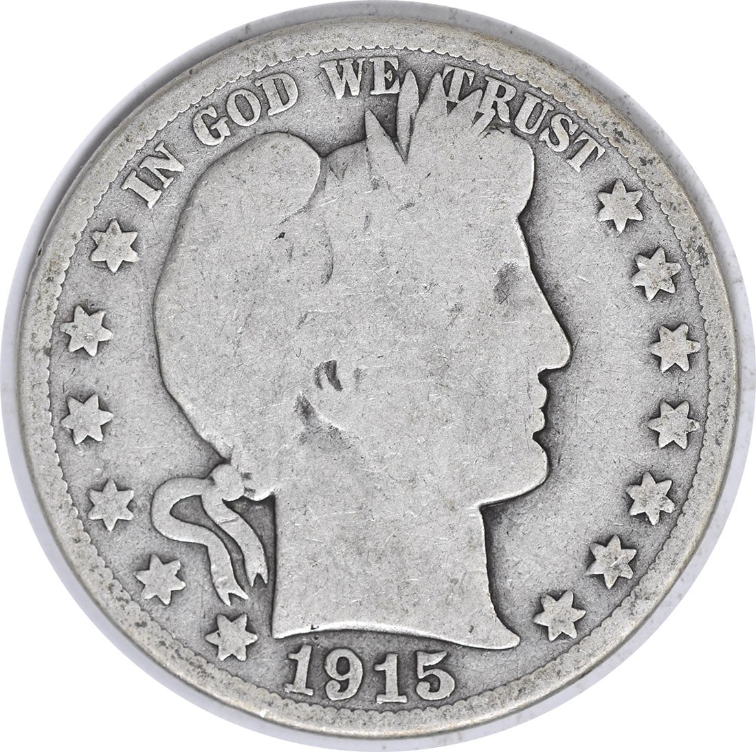 1915 Barber Silver Half Dollar 90% Silver Uncertified Coin: 1915 Barber Silver Half Dollar 90% Silver Uncertified Coin This 1915 Barber Silver Half Dollar is a historical coin featuring the iconic design by Charles E. Barber. The coin is circulated, reflecting