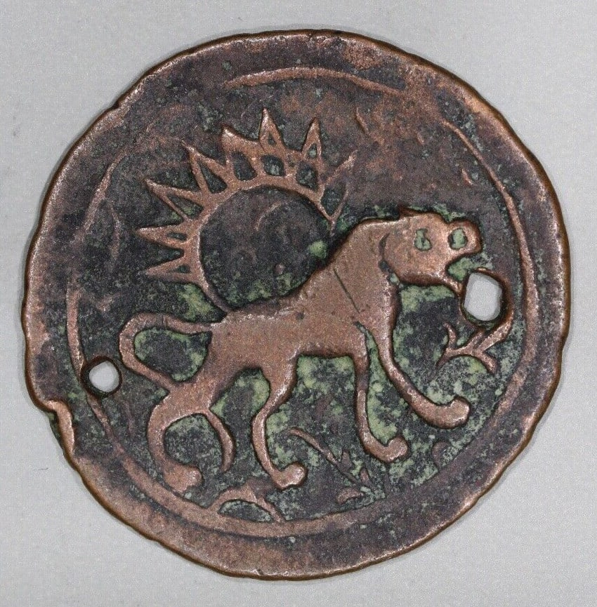 Falus Mint Safavid Copper Coin 1617-1766 Lion Design: Falus Mint Safavid Copper Coin 1617-1766 Lion Design This historical coin features a captivating design of a lion walking, representative of the Safavid era. Crafted from copper, this Falus denominati