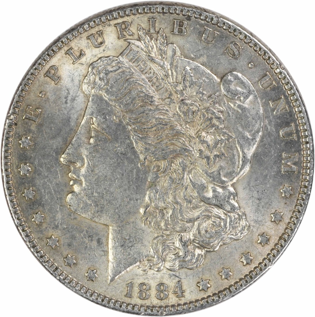 1884 Philadelphia Morgan Dollar AU Uncertified Silver Coin: 1884 Philadelphia Morgan Dollar AU Uncertified Silver Coin This 1884 Morgan Silver Dollar is an uncirculated coin from the United States, featuring a composition of 90% silver and 10% copper. Designed