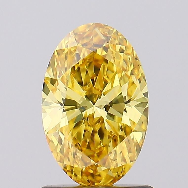 Loose Diamond - OVAL 1.0ct Fancy Vivid Yellow VS1: Loose Diamond - OVAL 1.0ct Fancy Vivid Yellow VS1 Source: This is a real non-mined Diamond that has been grown in a lab Shape: OVAL Carats: 1.0 Color: Fancy Vivid Yellow Certification: IGI Video: